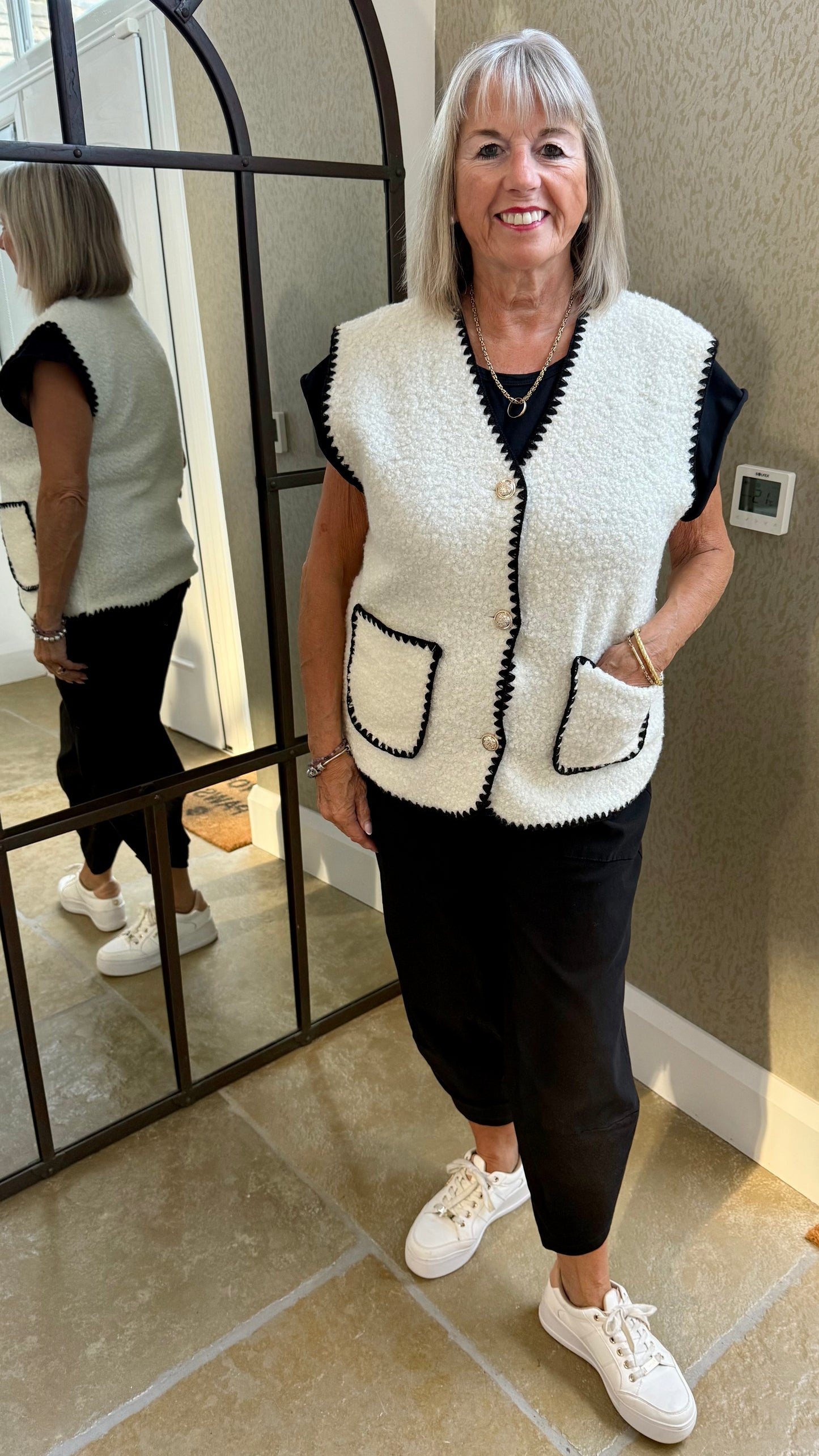 CREAM BOUCLE SLEEVELESS GILET WITH BLACK EDGING
