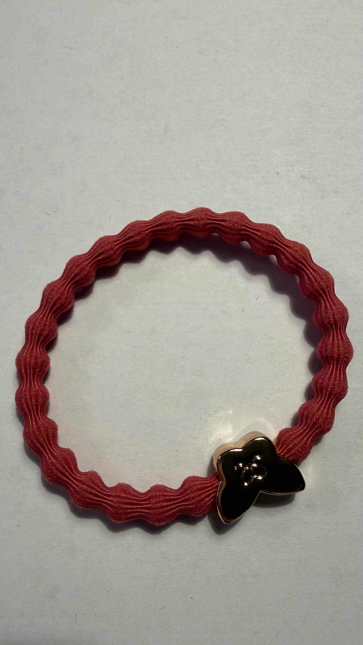 BYELOISE CORAL PINK BANGLE BAND WITH GOLD BUTTERFLY CHARM