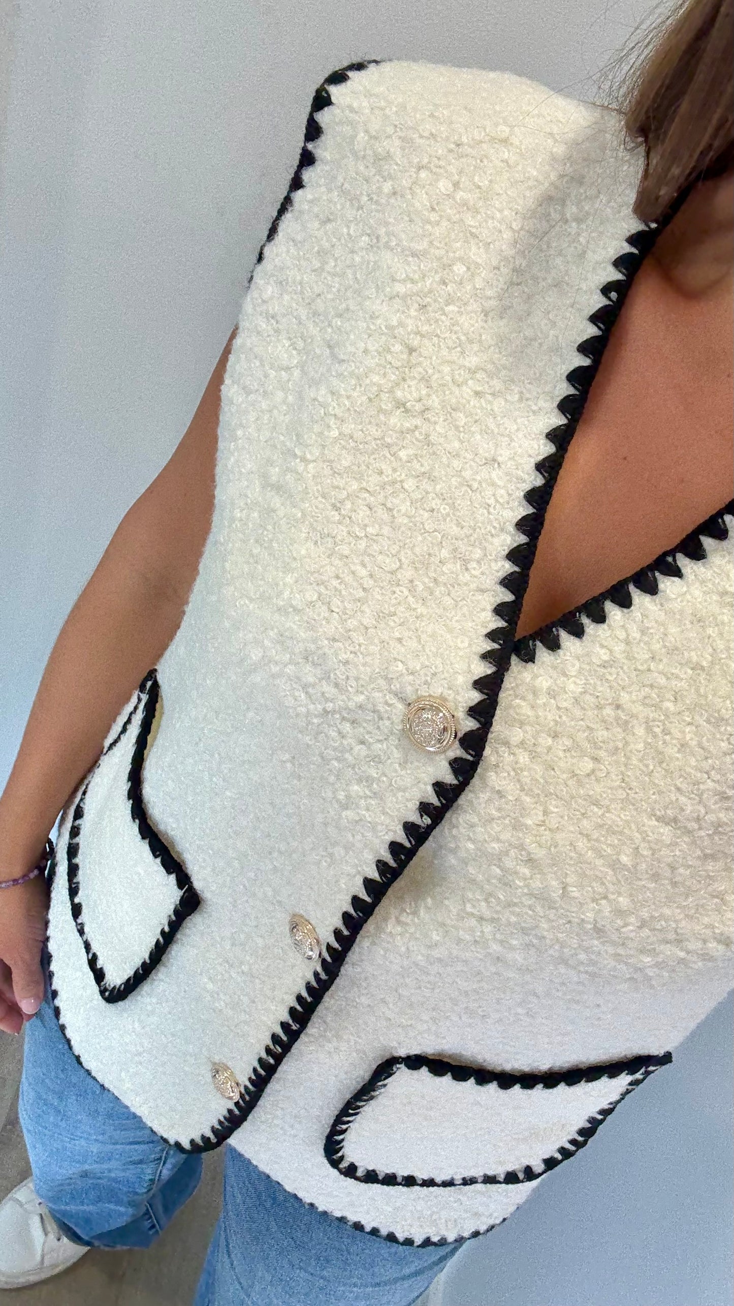CREAM BOUCLE SLEEVELESS GILET WITH BLACK EDGING